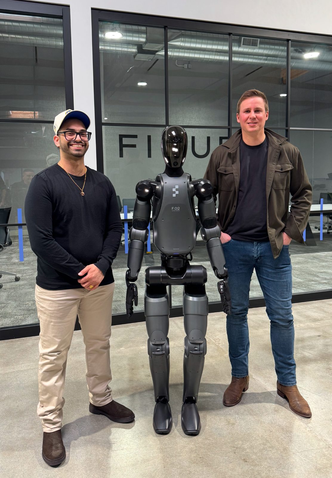 Amit with Figure founder Brett Adcock and the F.02 humanoid robot